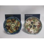 Two contemporary Moorcroft pottery annual year plates, one in the 'Tiger Lilies' 1999 pattern