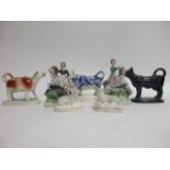 Three Victorian ceramic cow creamers, one Jackfield black, 16cm x 13cm, one sponge ware example