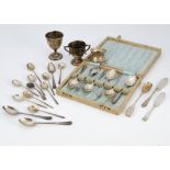 A collection of silver and silver plate, including silver teaspoons, a miniature silver trophy