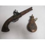 A novelty pistol and another novelty powder/shot flask, with field artillery and crossed rifle