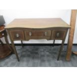 A Georgian mahogany serpentine fronted sideboard, the top with boxwood and ebony stringing with