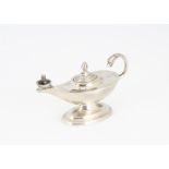 A 1950s silver small novelty table lighter, in the form of a Roman oil lamp, Birmingham 1955, 8.