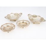 Two pairs of Edwardian silver bon bon dishes from Mappin & Webb, the smaller circular and the larger