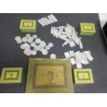 A collection of 19th Century mother of pearl gaming counters, in several shapes, including fish,