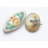 A Royal Worcester porcelain 9ct gold framed oval brooch, decorated with a red breasted bullfinch,