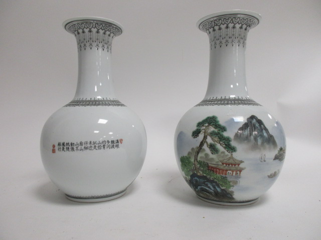 A pair of Chinese 20th Century vases, each bulbous body with polychrome over glaze enamel