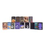 A collection of various Camel Zippo Lighters, including Midnight Oasis, Classic Camel with raised