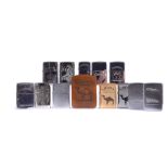 An assortment of 13 Camel Zippo Lighters, mainly engraved Polished Chrome, including Camel Rare R