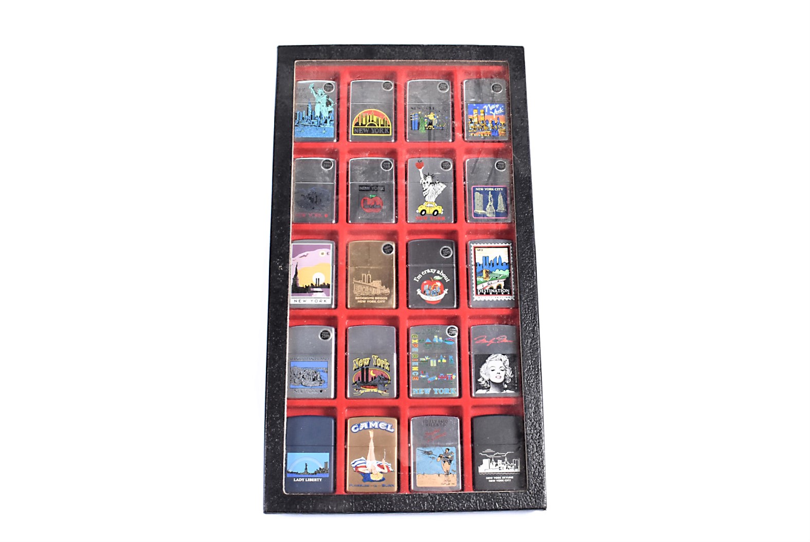 A collection of 20 New York-related Zippo Lighters, including The Destination Series, Statue of