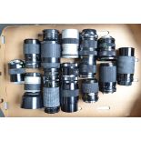 A Tray of Zoom Lenses, various mounts, including a Siirus 18-28mm zoom lens, Tamron AF lenses, other