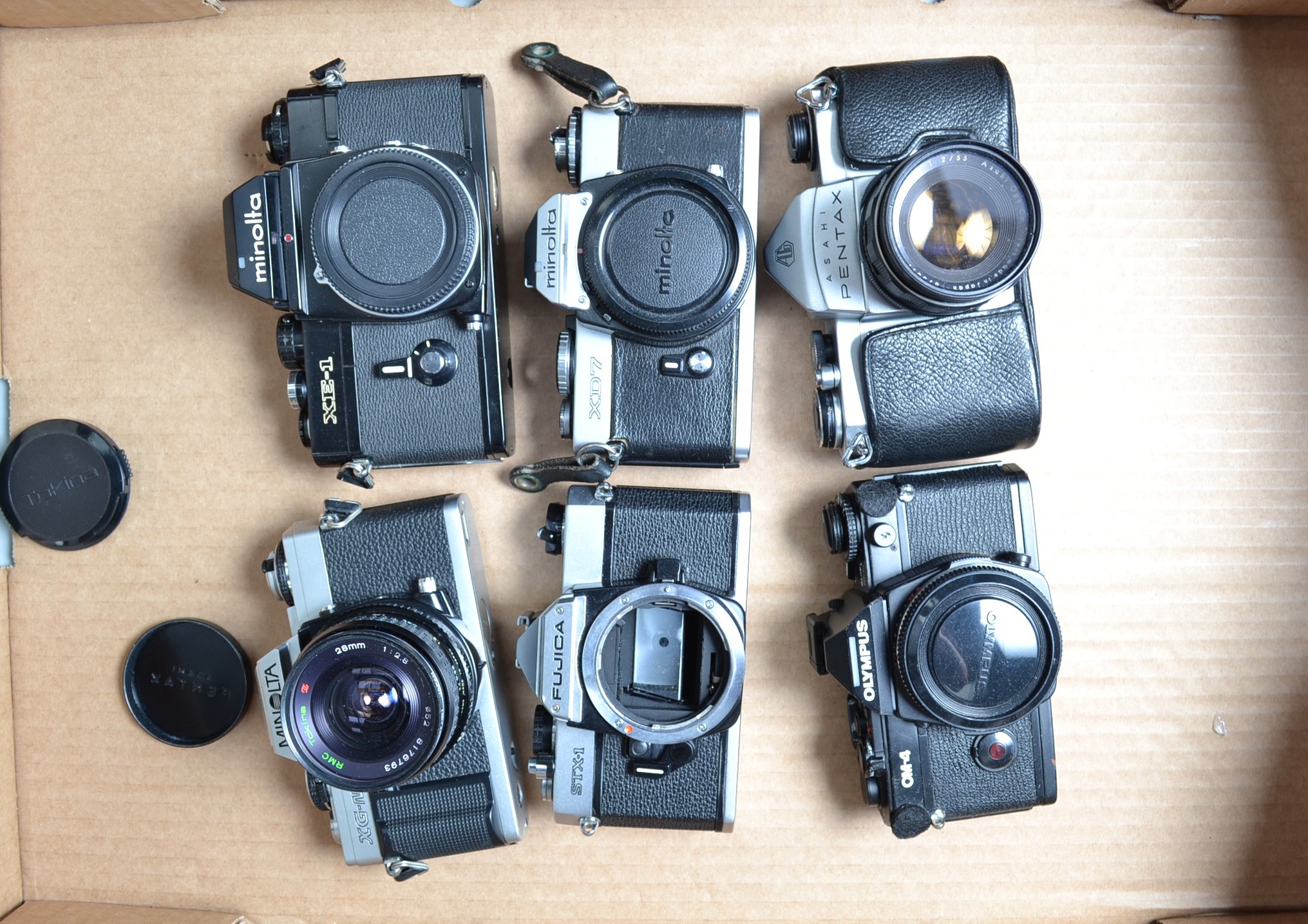 SLR Cameras and Bodies, a Minolta XG-M , with Tokina 28mm f/2.8 lens, Pentax Asahi, with 55mm f/2