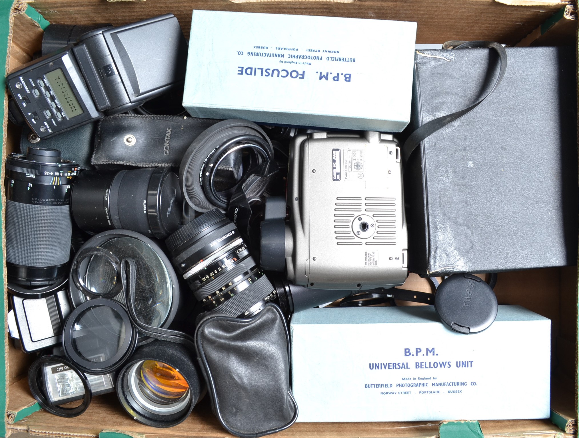 A Tray of Camera Related Accessories, including, adaptor rings, focusing bellows, lenses, flash