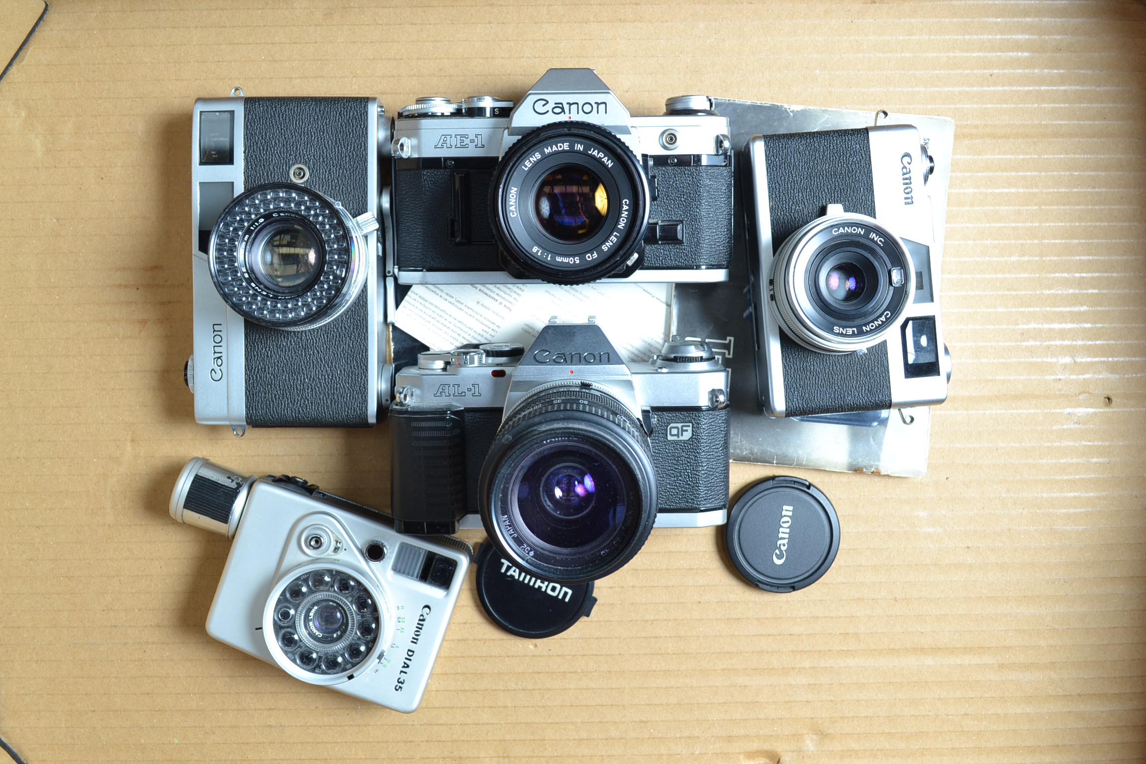 Canon Cameras, a Canon AL-1 QF, with 28-70mm Tamron lens, AE-1 with 50mm f/1.8 FD lens, Canonet,