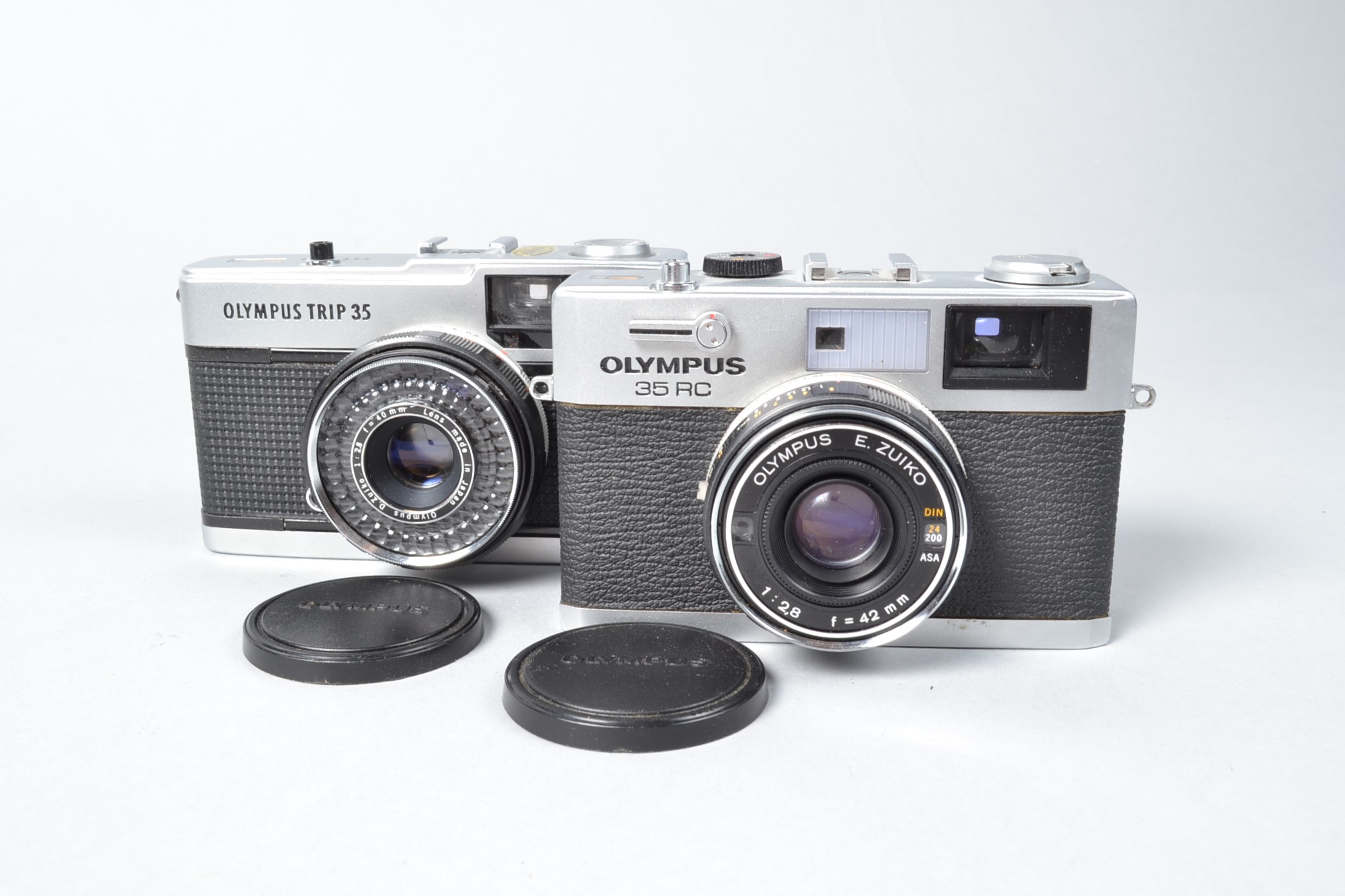 Two Olympus Compact Cameras, an Olympus 35 RC, with E Zuiko 42mm f/2.8, untested, and an Olypus Trip