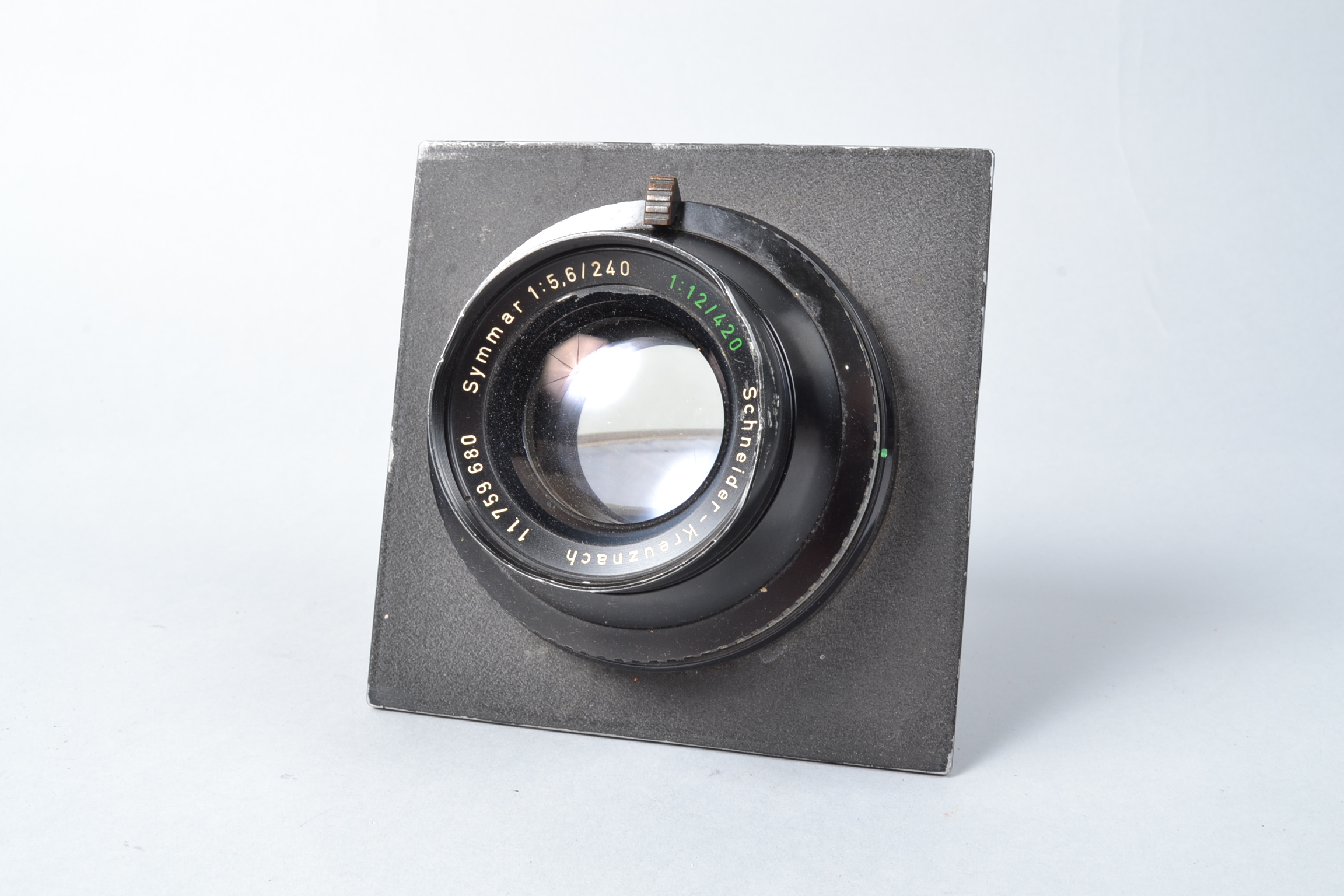 A Schneider Kreuznach Symmar 240mm f/5.6 Large Format Lens, serial no 11759680, large ding to filter