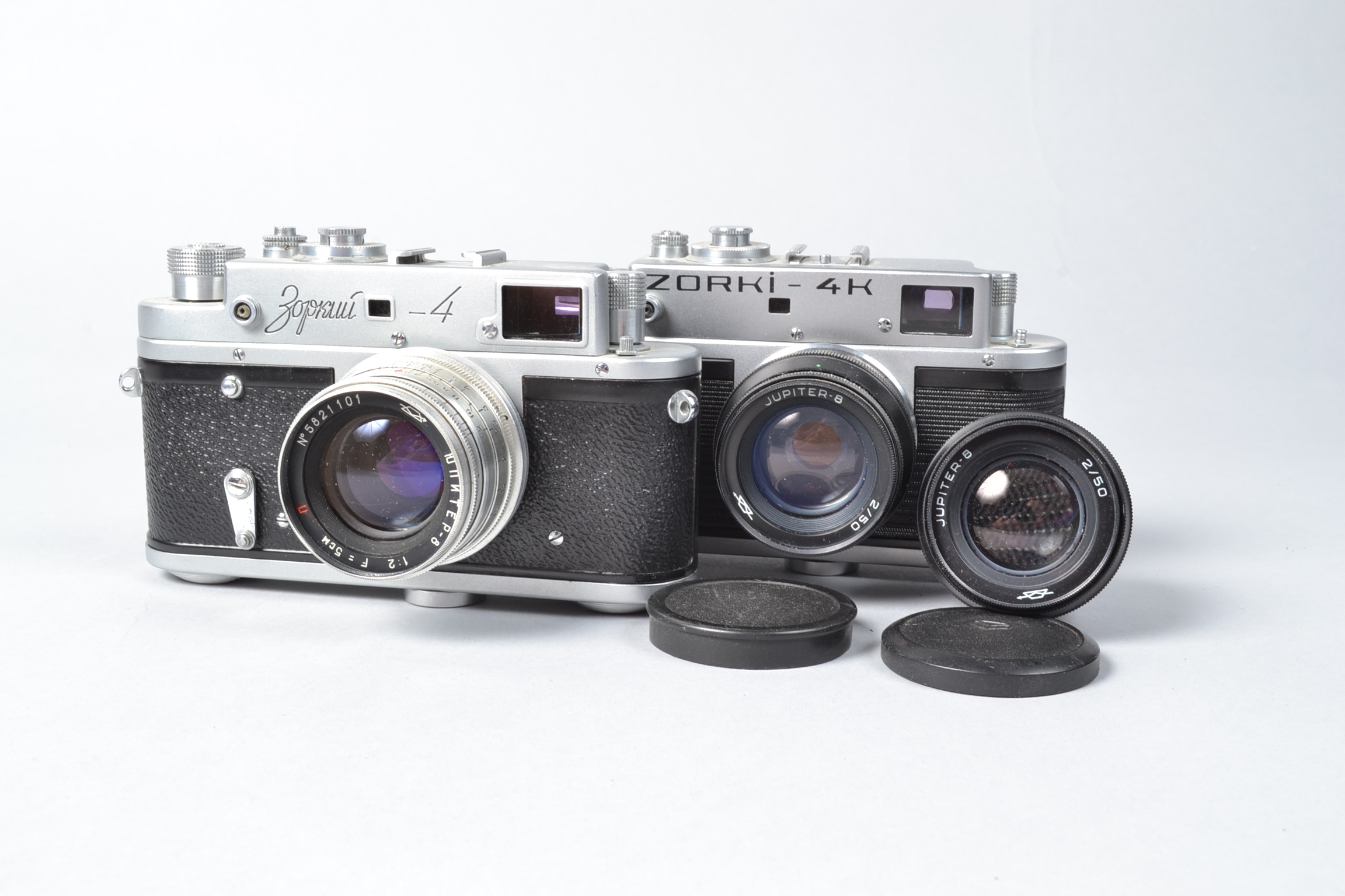 Two Zorki Cameras, a Zorki 4 Cyrillic, with Jupiter 6 5cm f/2 lens, a Zorki 4K, with Jupiter 8