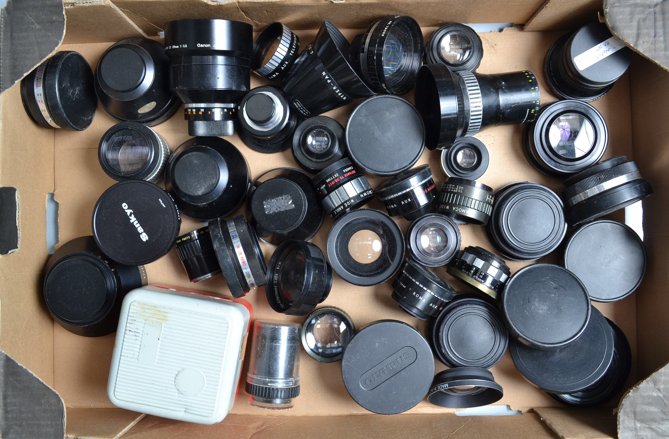 A Tray of Tele-Converter Lenses, manufacturers including Sankyo, YAsahikor, Olympus, Komura and some