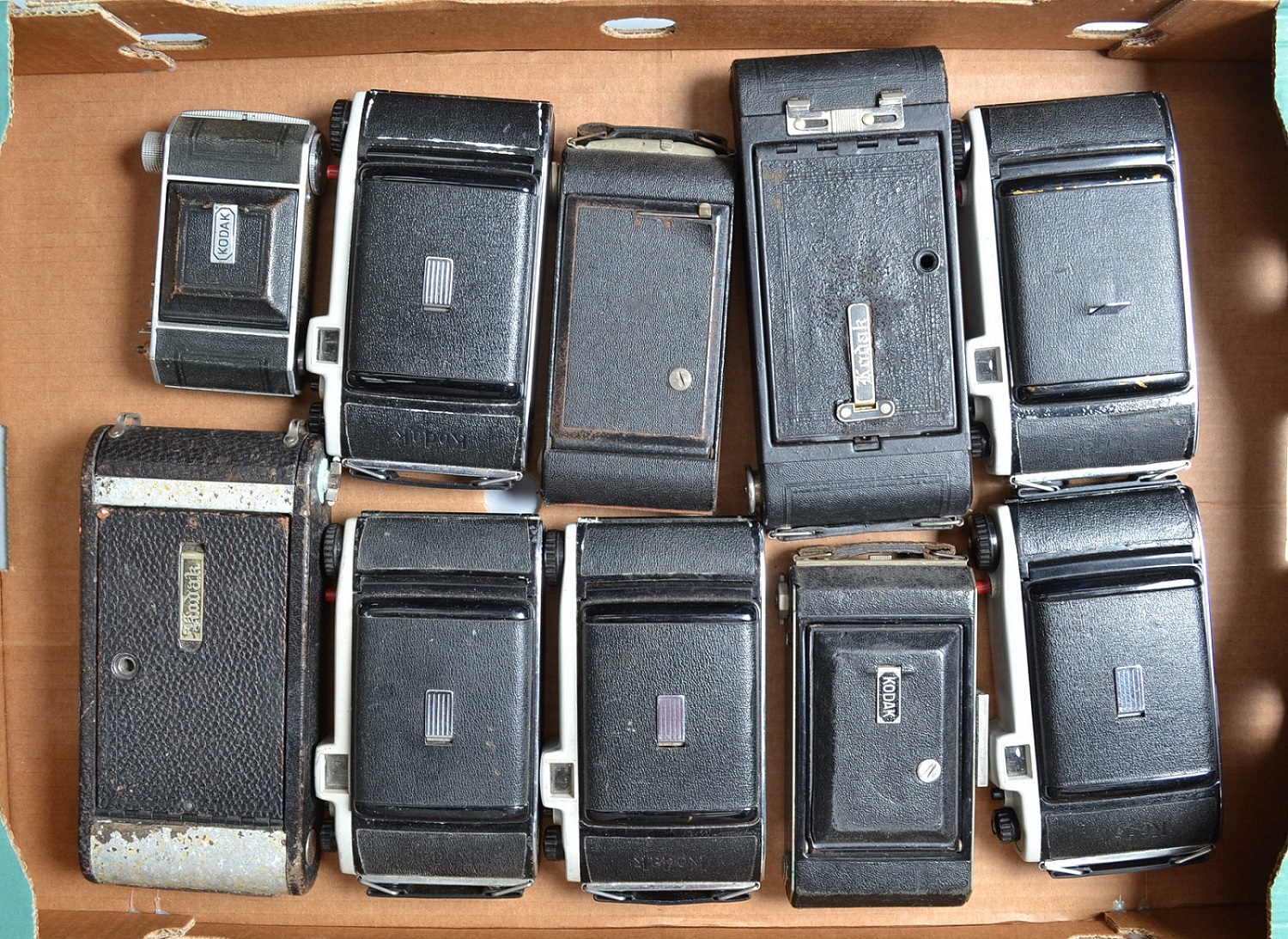 A Tray of Kodak Folding Cameras, including a Kodak Six-16, pocket Kodaks, Kodette III's and other