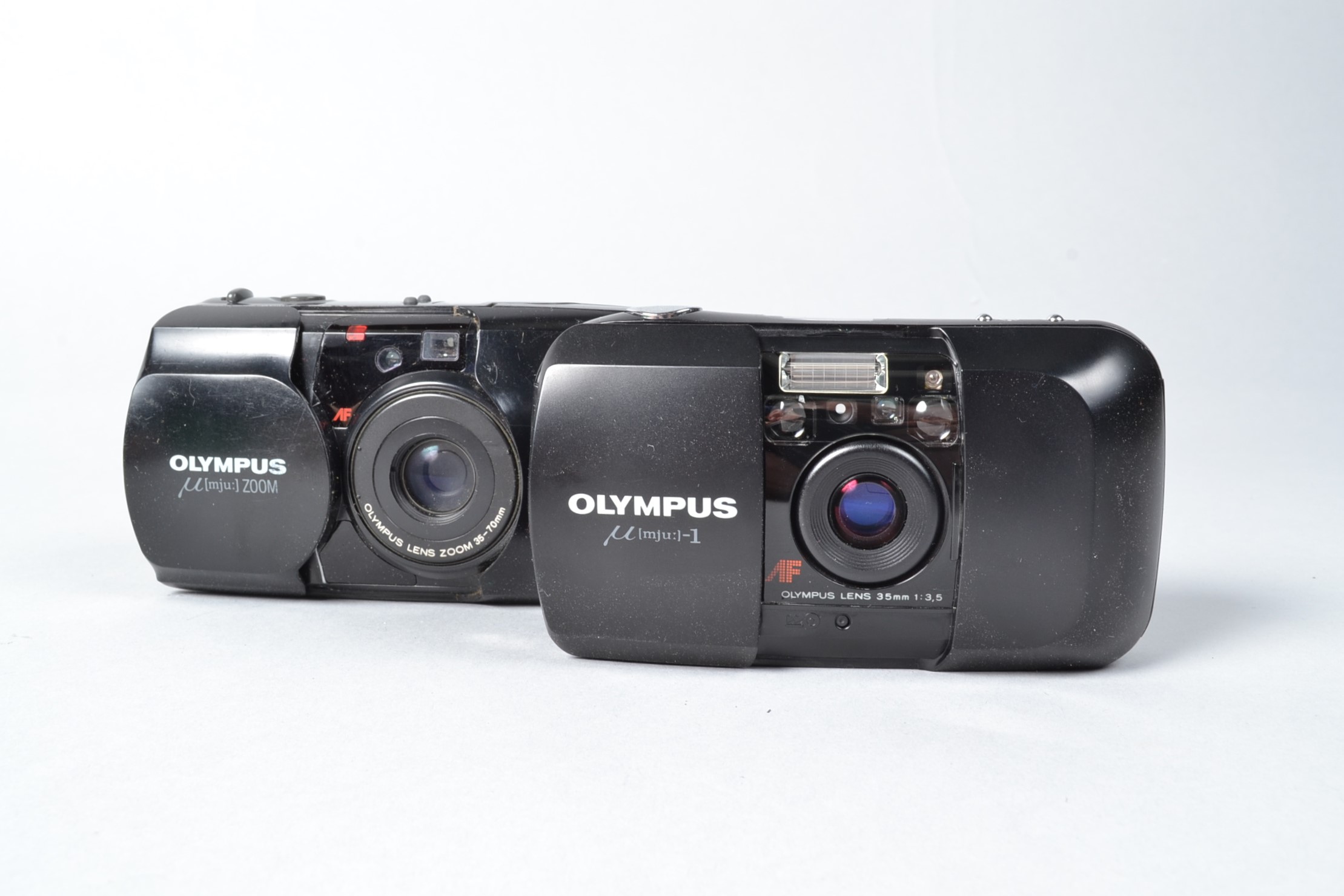 Two Olympus Compact Cameras, a mju-1, powers up otherwise untested and a mju zoom, untested