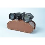 A Pair of Newbold & Bulford Binoculars, engraved Britannia Coated Lenses, body F-G, ding to one rim,