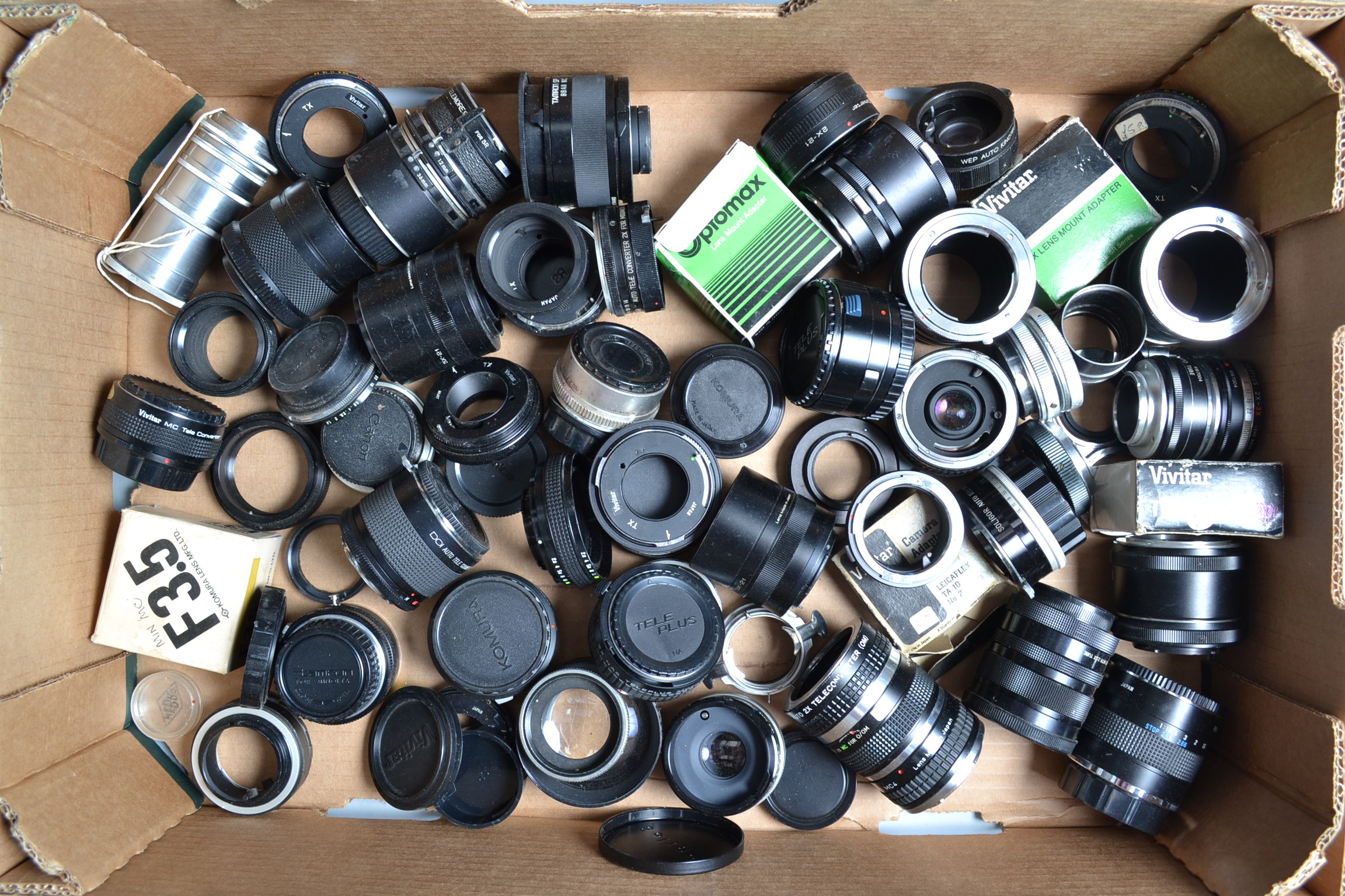 A Tray of Adaptor Rings Teleconverters and Tubes, manufacturers including Vivitar, Miranda, Olympus,