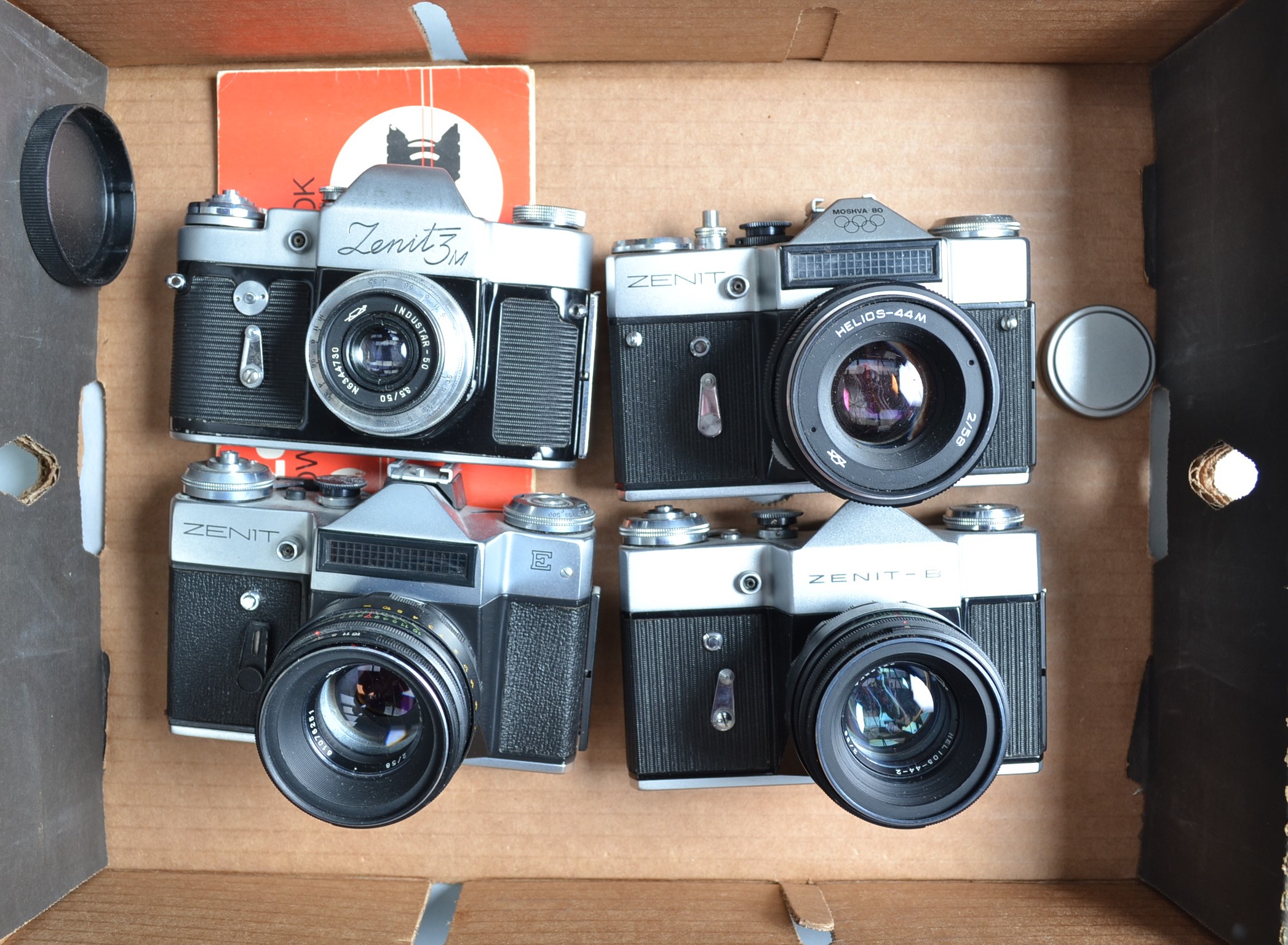 Four Zenit Cameras, a Zenit 3M, with Industar 50mm f/3.5 lens, EM Moskva 80, with Helios-44M 58mm