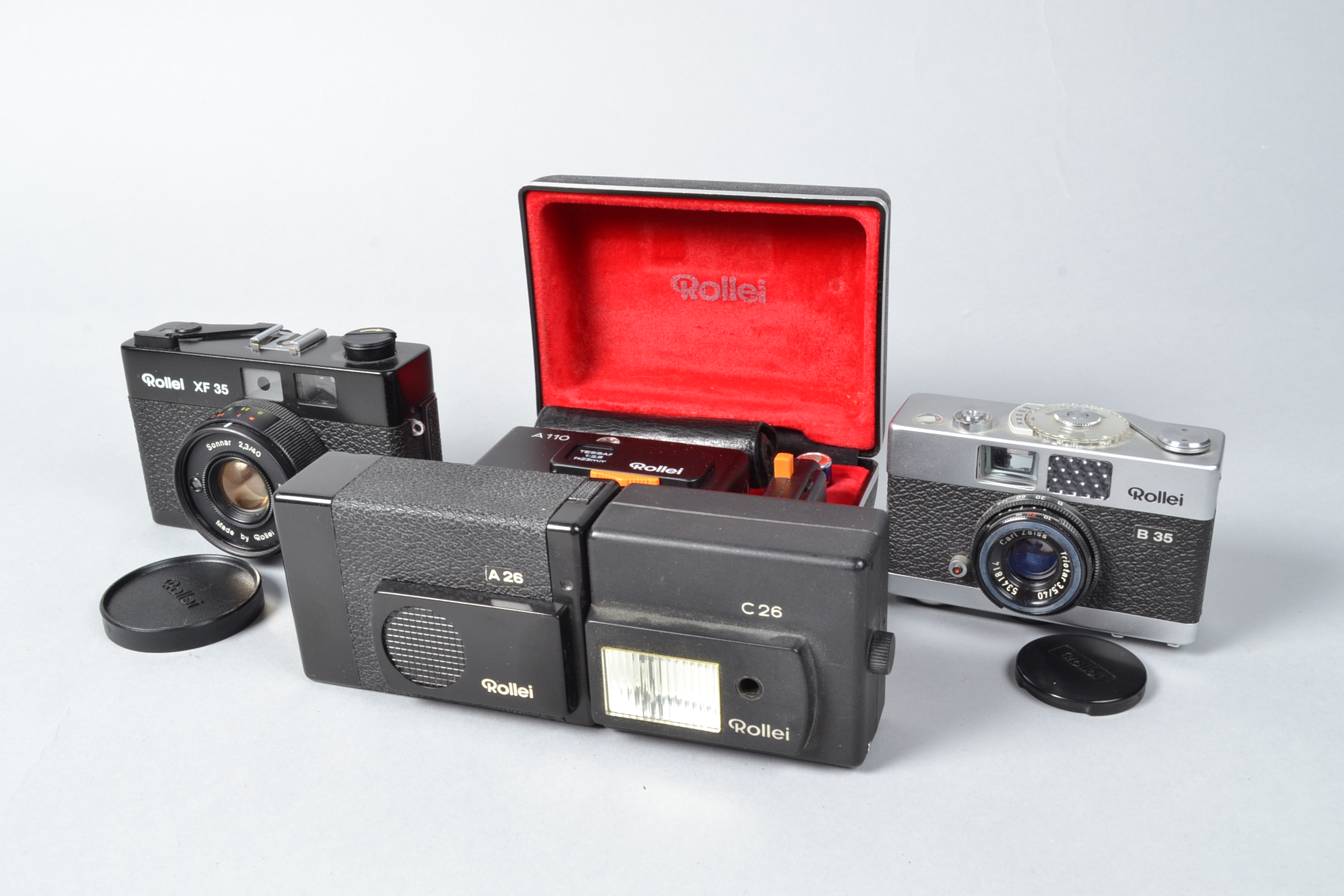 Four Rollei Compact Cameras, a Rollei B35, XF 35, A26, with C26 flash and a A 110, in case with