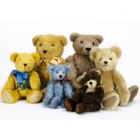 A Bluebell artist teddy bear, fully jointed —10in. (25.5cm.) high; a blue HollyBerry Bear; and