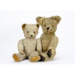 A 1940s teddy bear, probably French with golden mohair, clear and black glass eyes with remains of