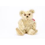 ’Susie’ a Moritz Pappe long cream mohair musical teddy bear 1920s, with bright orange and black