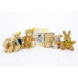 Small yellow tagged Steiff teddy bears: a jointed Happy rabbit —5in. (12.5cm.) high; a Merci bear