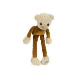 A rare Chad Valley Tango teddy bear 1930s, with white wool plush head, hands and feet, orange and