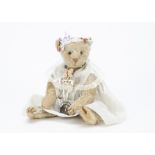 ’Dolly’ a white mohair American teddy bear circa 1910, with black boot button eyes, remains of brown