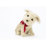 A fine Steiff Molly dog 1930s, with long white mohair, brown and black glass eyes, black stitched