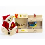 A Steiff yellow tagged Father Christmas teddy bear, with red costume —10 1/2in. (26.5cm.) high; a