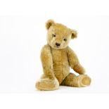A fine Chiltern 1930s Hugmee teddy bear, with blonde mohair, clear and black glass eyes,