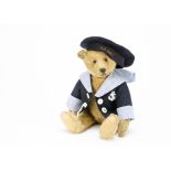 An early Steiff teddy bear circa 1910, with golden mohair, black boot button eyes, pronounced