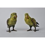 A pair cold painted bronze figures of Keas, each parrot with brightly coloured feathers, height 17.