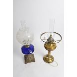 An early 20th Century oil lamp, Duplex, 'Made in England', together with another blue glass