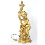 A gilt lamp in the form of a cherub, approximate height 74cm, sold for decorative purposes