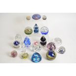 A small collection of 20th Century glass paperweights, to include an example in the form of a