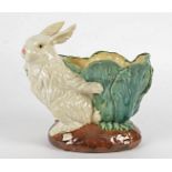 A large pottery jardinière taking the form of a rabbit holding a cabbage, probably Continental,