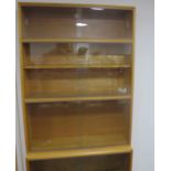 A mid- century Simplex light oak six tier sectional bookcase, six various size sections, two