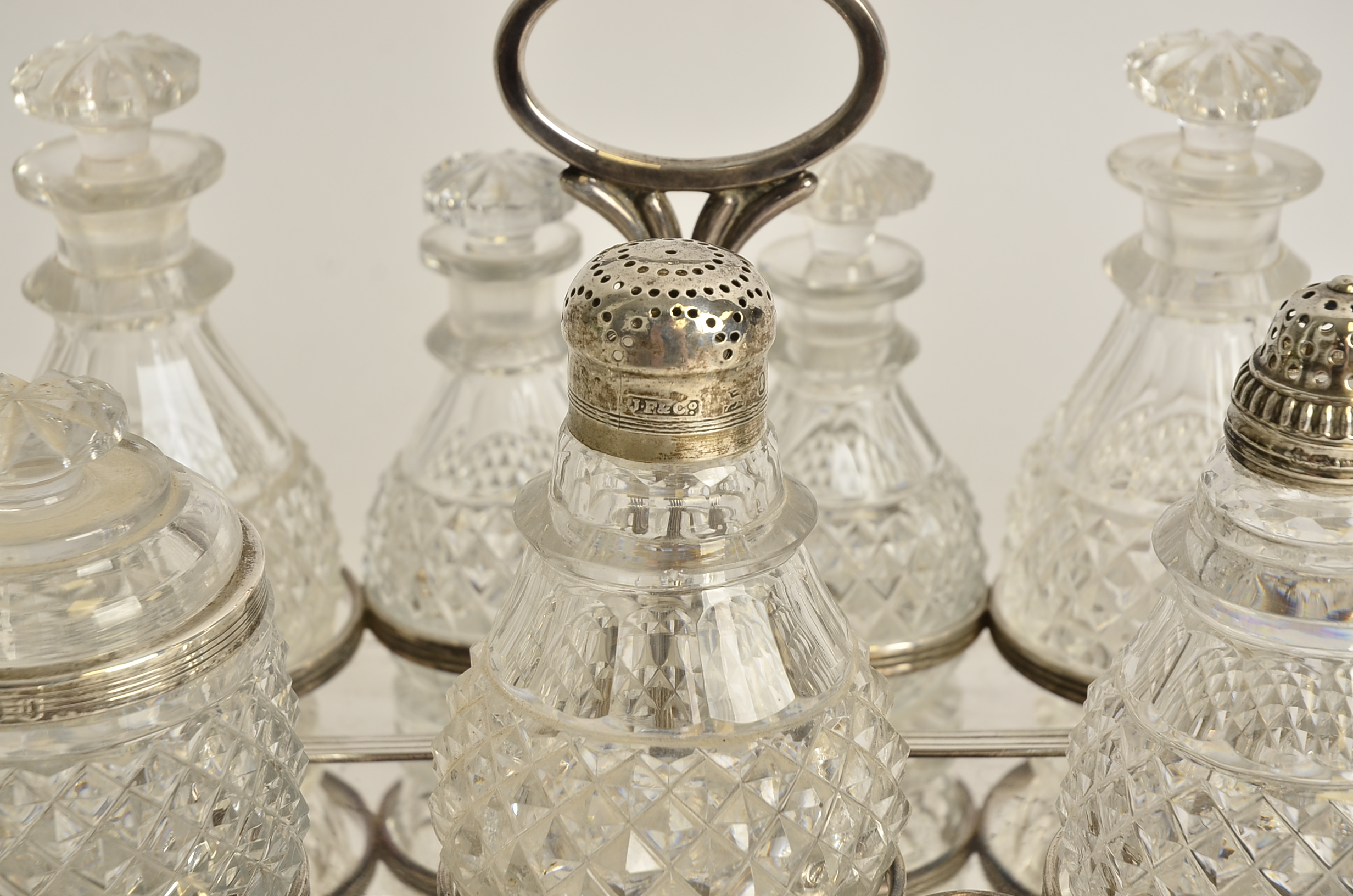 A seven part cruet set on plated stand, with a Georgian pierced silver lid, hallmarked for Sheffield - Image 2 of 5