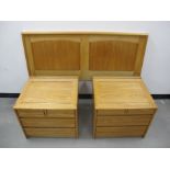 Two Cotswold School style bedside cabinets, oak frames with panelled sides and tops, mahogany drawer