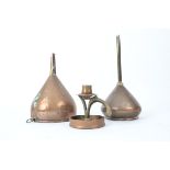 Two late 19th or early 20th Century copper funnels, together with an Arts and Crafts style copper