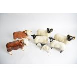 Seven novelty figures of cattle and sheep, to include Coopercraft and Nelson pottery of