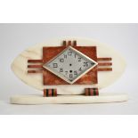 A French Art Deco mantel clock, in red and white marble, silvered face with Arabic numerals and a