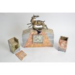 A French Art Deco clock garniture, in red and grey marble, silvered square face with Arabic