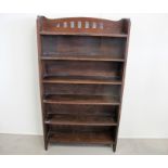 An Arts and Crafts solid oak floor standing bookcase, comprising of six fixed graduated shelfs, 92cm